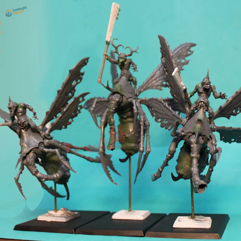 Miniature winged horned figurines on brass tubes for scale modeling
