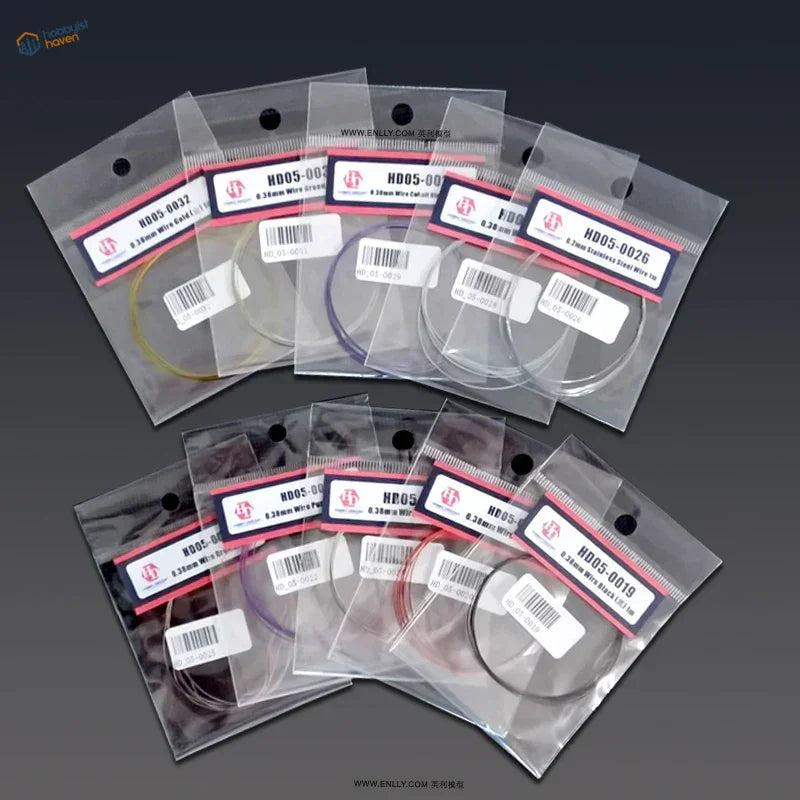 0.38mm colored steel wire spools in clear bags, yellow purple red hues