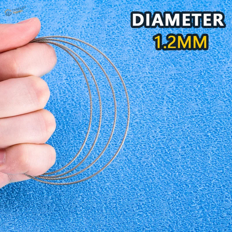 Silver-colored 1.2mm diameter steel tow cable with braided texture for scale models and scale modeling tools against blue background