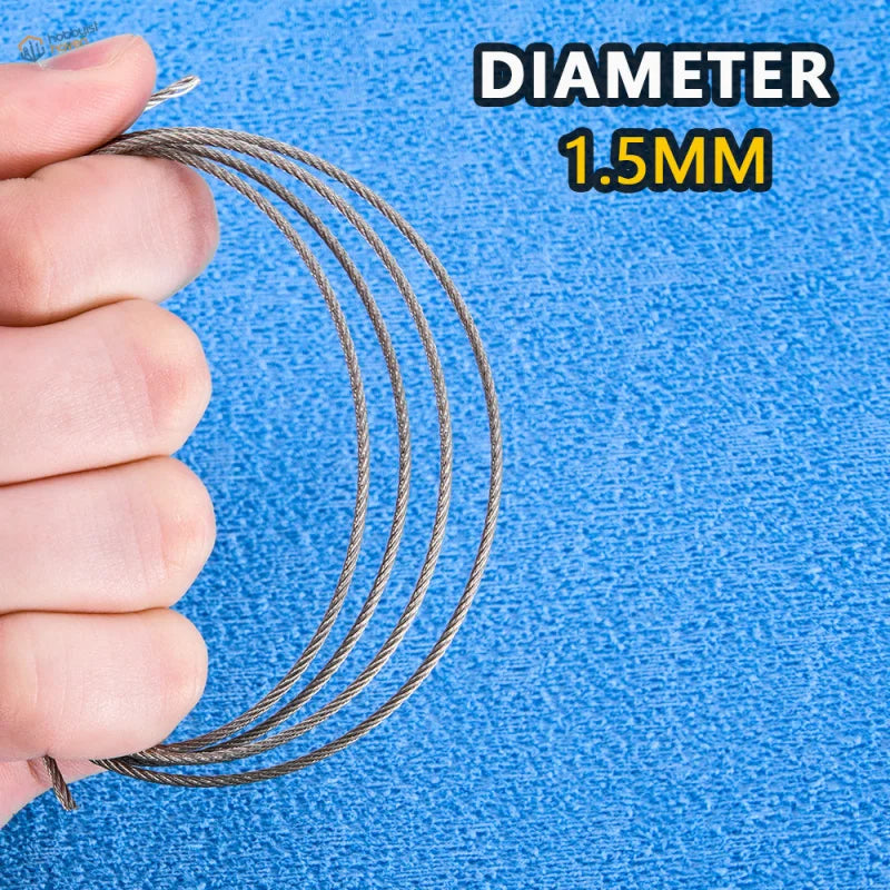 A 1.5mm diameter steel tow cable for scale models coiled and held in hand against a blue background for scale modeling tools
