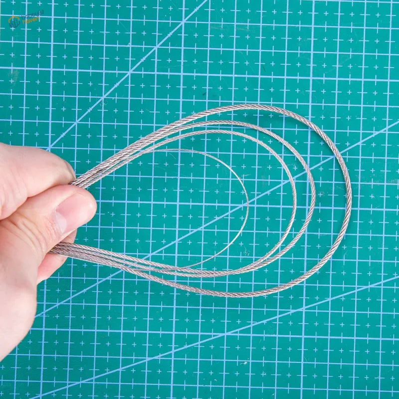 Silver-colored steel traction cable composed of tightly twisted strands for 0.5 to 2mm model uses