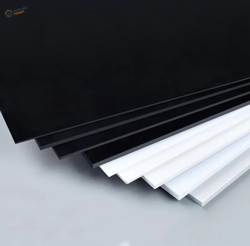 Stacked white styrene sheets, 0.5-3mm thick, glossy acrylic finish
