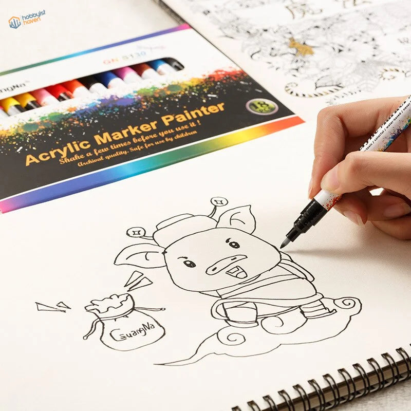 Hand holding 0.7mm acrylic paint marker pen coloring cartoon pig