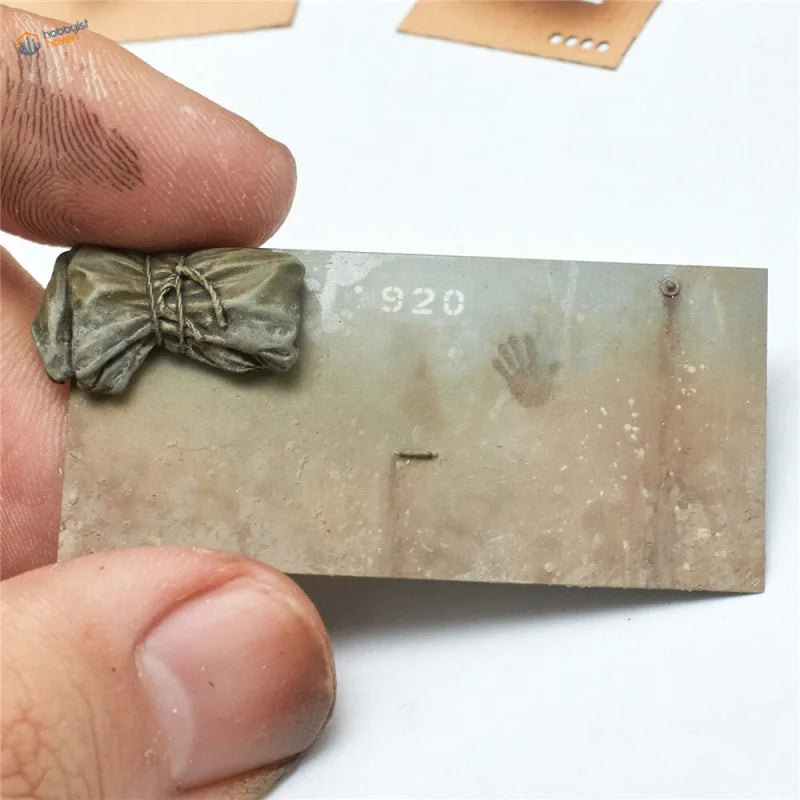 Miniature olive-green paw print stencil bundle with handprints on 920 plaque