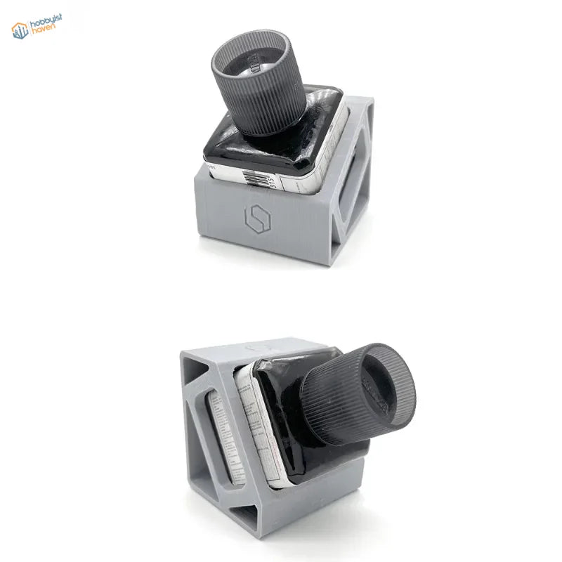 Gray plastic glue holder with knob holding smartphone for scale modeling
