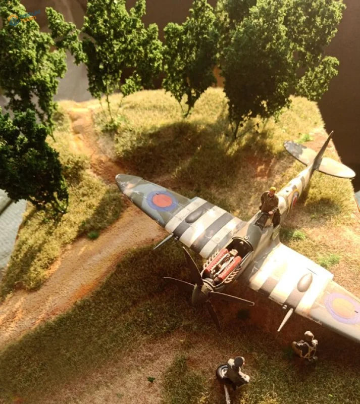 Detailed Supermarine Spitfire model amid 1/35 dense tree for scale modeling tools