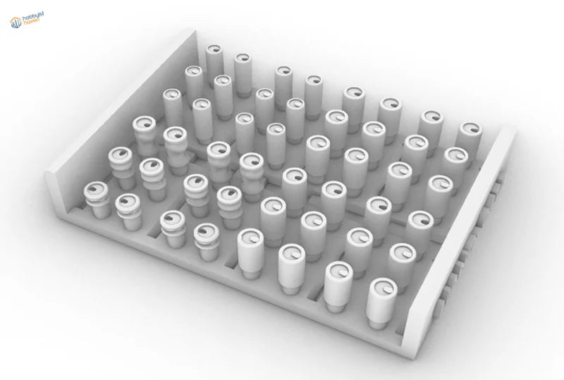 White plastic tray with battery cells in 3D printed soda cans and cardboard boxes