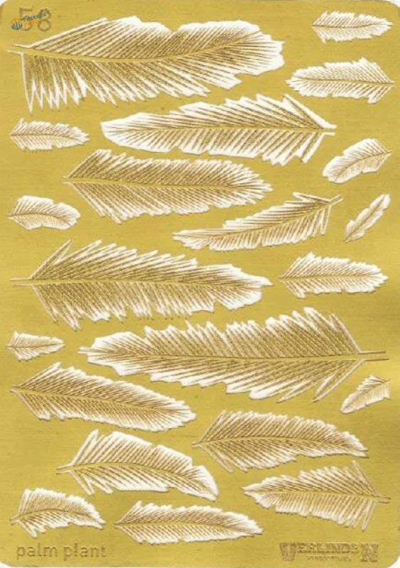 Gold foil photoetch palm leaves on yellow backing sheet