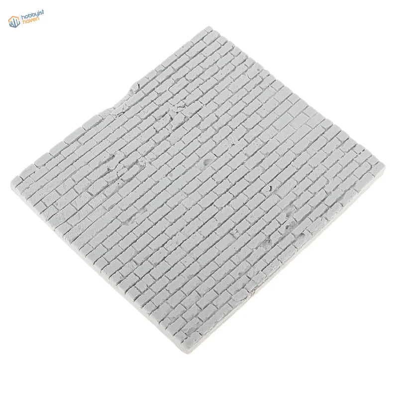 Gray brick-patterned miniature tile on 1/35 resin brick wall