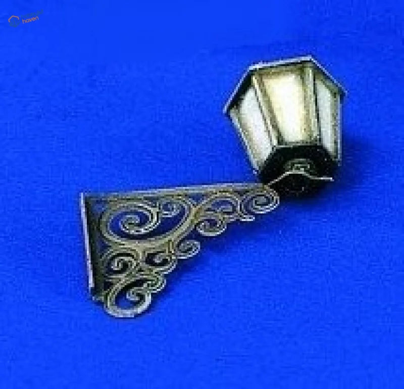 1/35 resin model of antique brass street wall lamp with ornate scrollwork