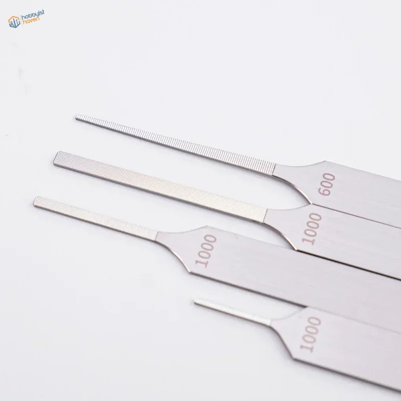 Set of four extra fine stainless steel files marked 1~3mm