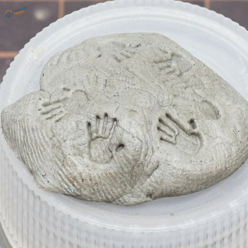 Gray concrete 3D printed handprint stamps with embossed texture in container