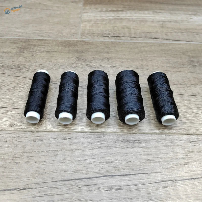 Five spools of 0.35-0.8mm black rope on white cores for scale modeling tools