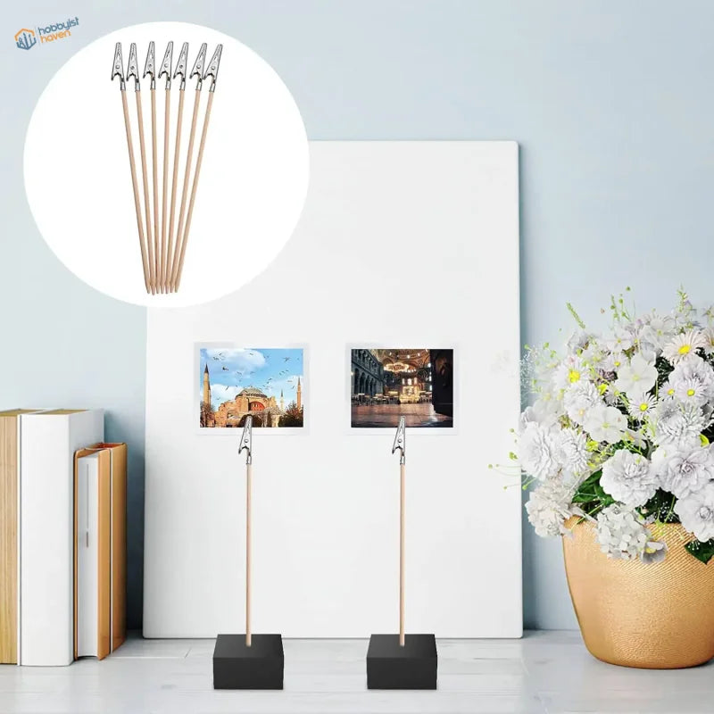 Six wooden photo stands with black bases and silver alligator clips