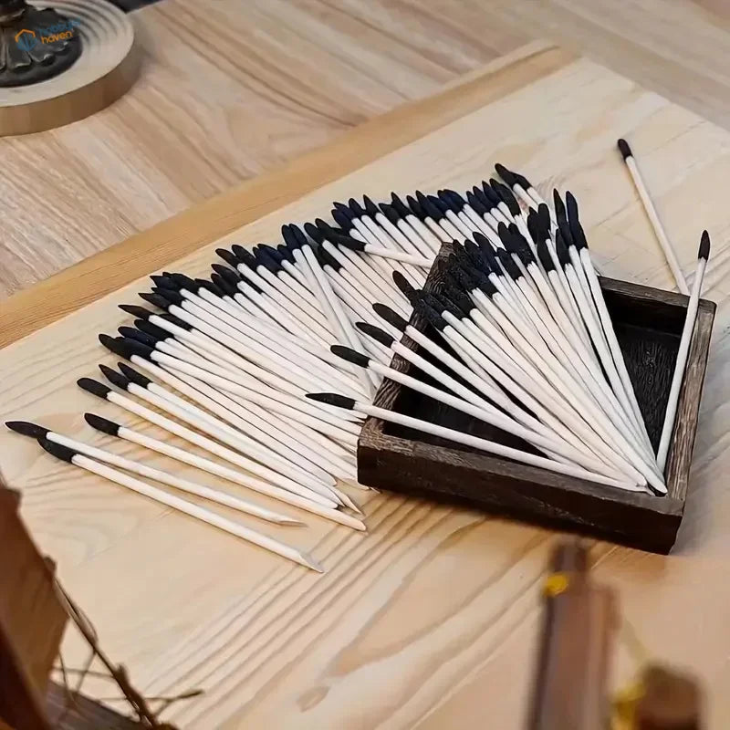 White and black sanding matchsticks in dark wooden box