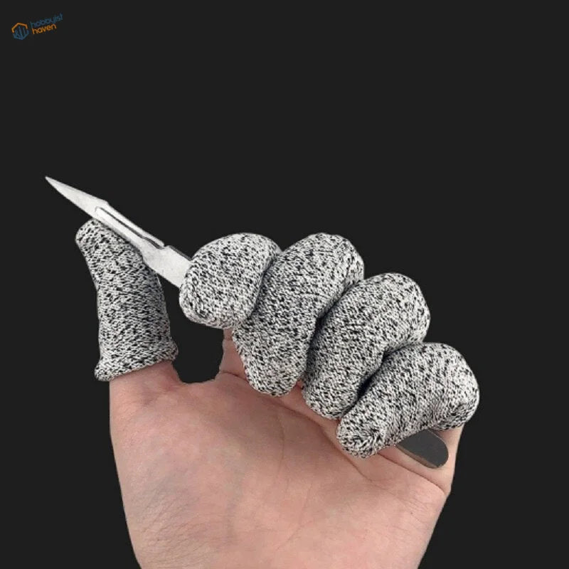 Gray level-5 safety finger sheaths with speckled texture on hand holding knife