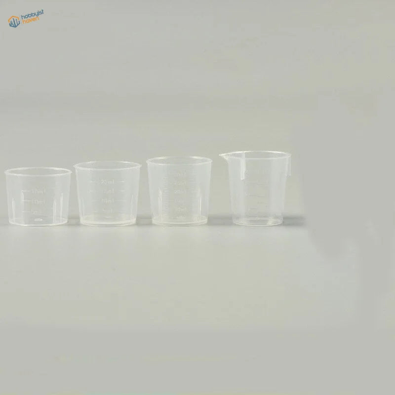 Set of 4 transparent mixing cups with spout on largest