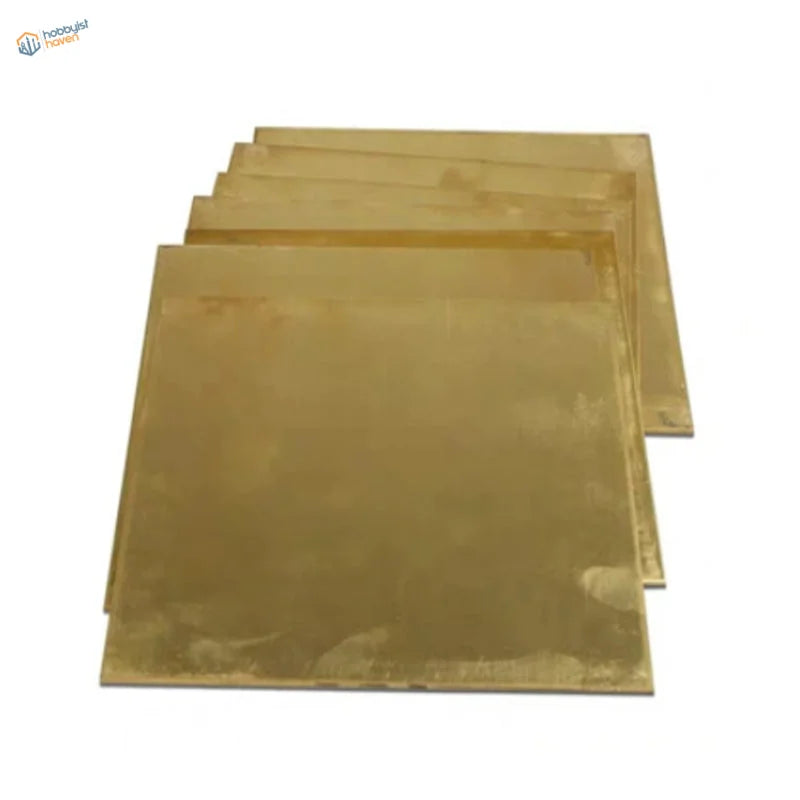 Stack of 100x100mm H62 brass sheets with golden hue and textured surface