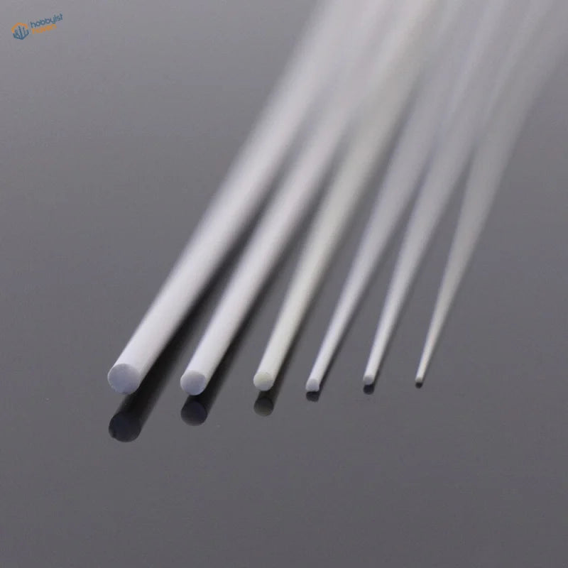 White translucent styrene round rods 0.5-2.5mm on reflective surface