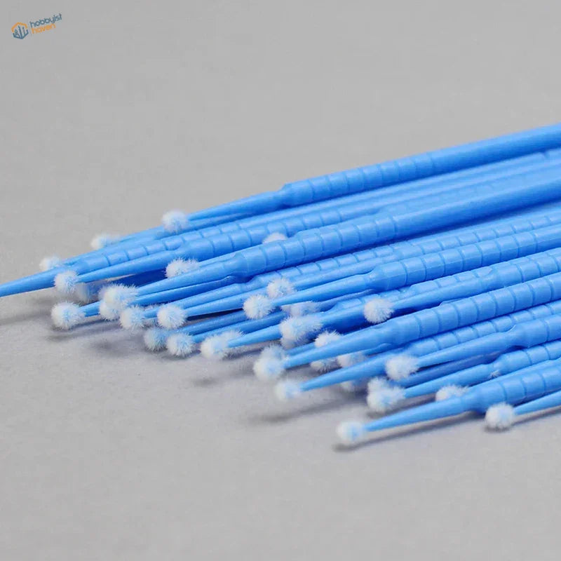 100pcs mini brushes with blue plastic handles and white fluffy tips