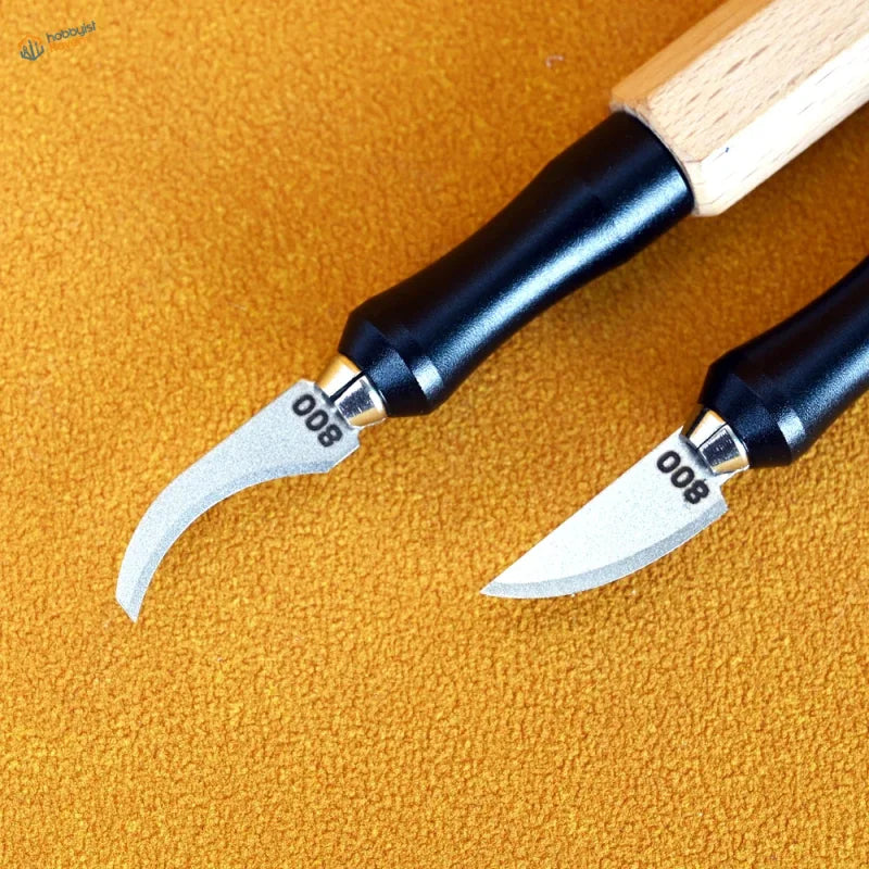 Two precision leather carving tools with black ergonomic handles and silver curved emery file blades from 100Shiki