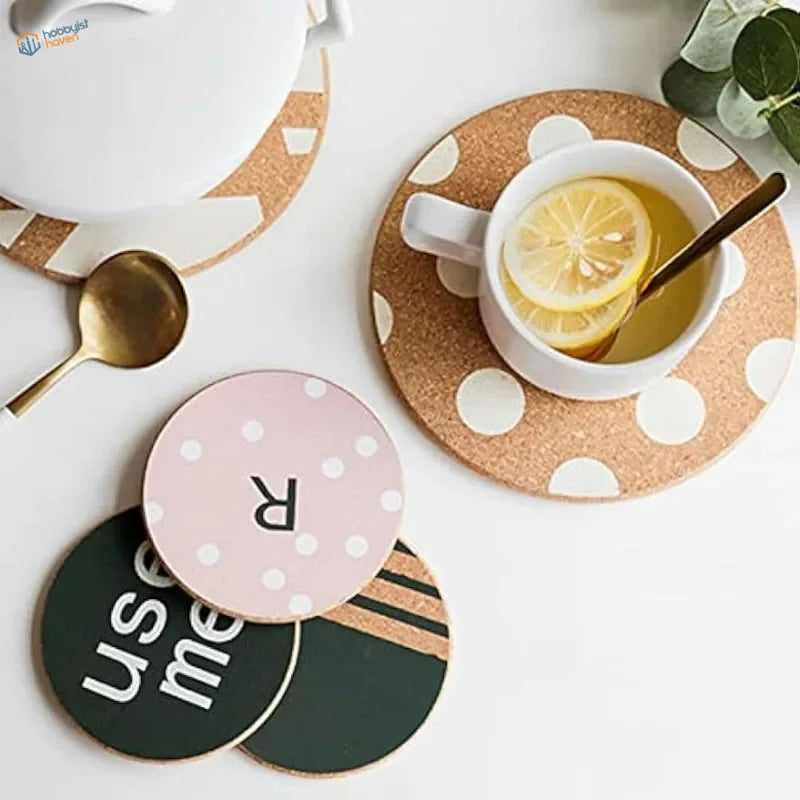 Pink polka-dotted 2mm cork sheet coaster with black r letter
