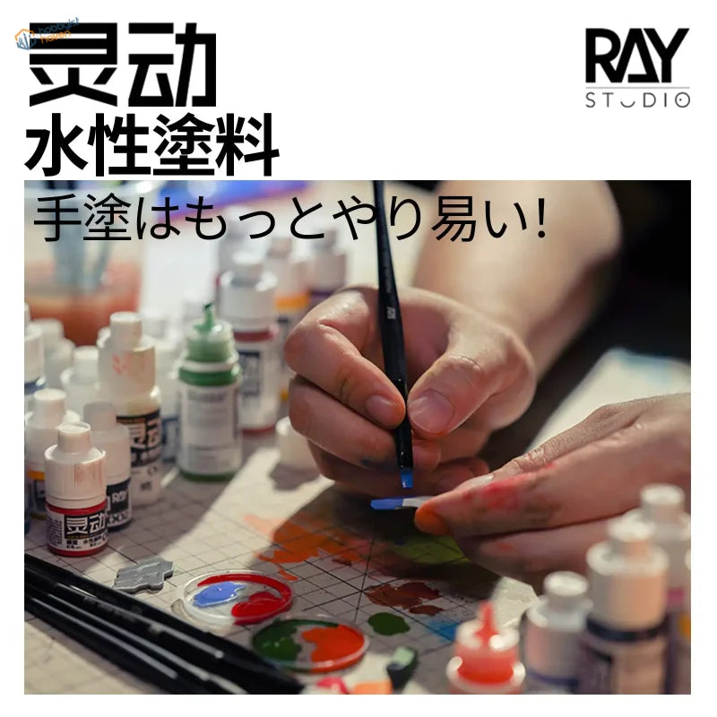 Hand with paintbrush applying blue acrylic paint to Gundam model using scale modeling tools