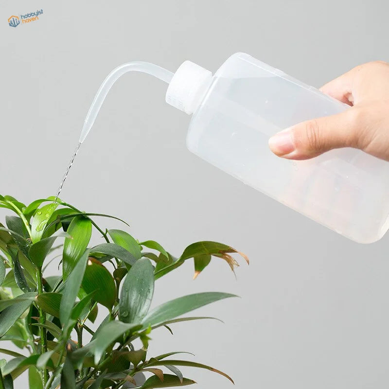 Transparent 500ml water squeeze bottle with white cap and curved spout