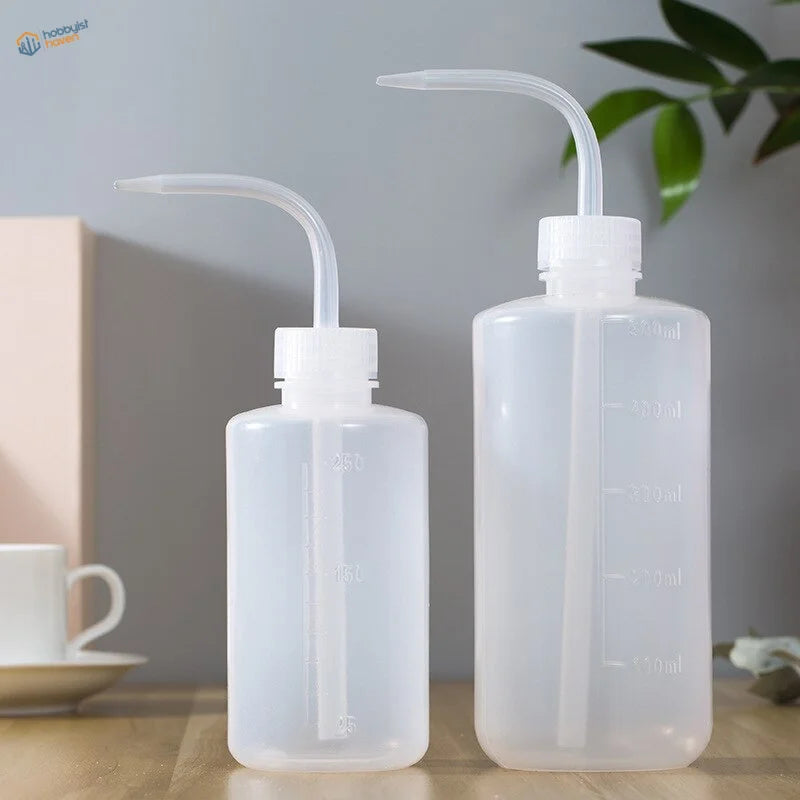 Two translucent 150/250/500ml water squeeze bottles with ml markings