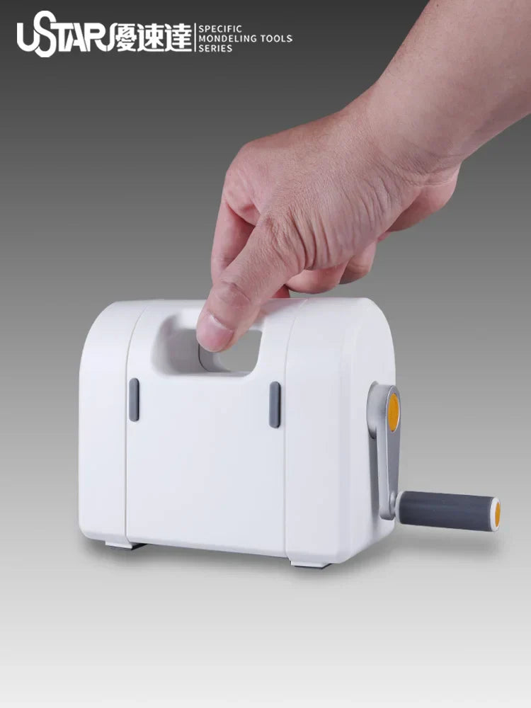 White plastic hand-cranked masking tape die cutting machine with gray handle