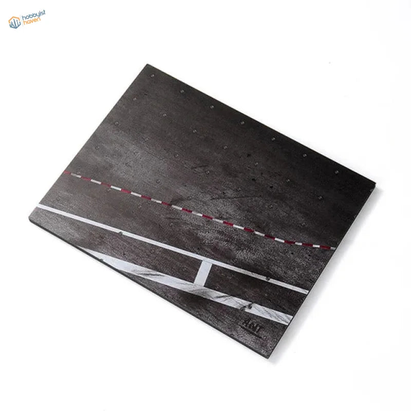 Black realistic runway base on textured cutting board with road markings