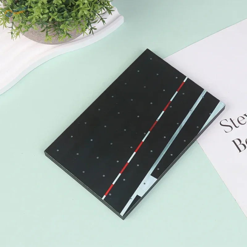 Black realistic runway base notepad with red white stripes and blue edge