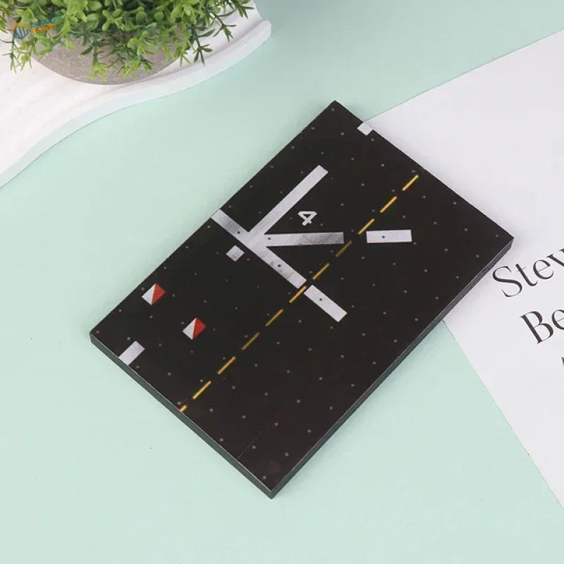 Black retro notebook with realistic runway base design