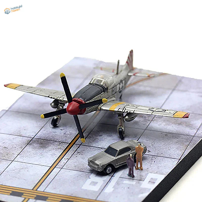 Silver and black P-51 Mustang diecast on realistic runway base