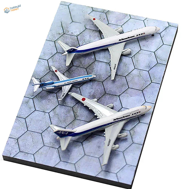 Three white blue mini airplanes on realistic runway base display