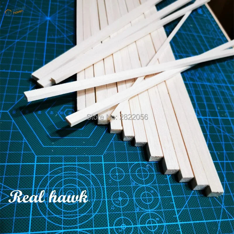 25 pcs 250mm AAA+ balsa wood strips on blue mat