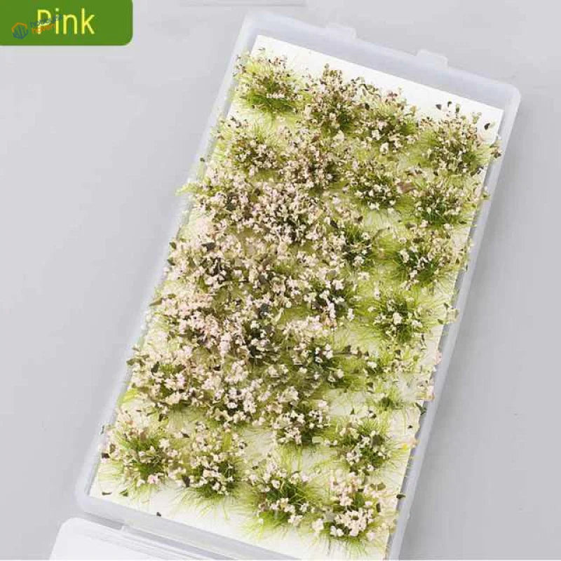 Exquisite miniature flower clusters in pink plastic container with dried flowers and grass