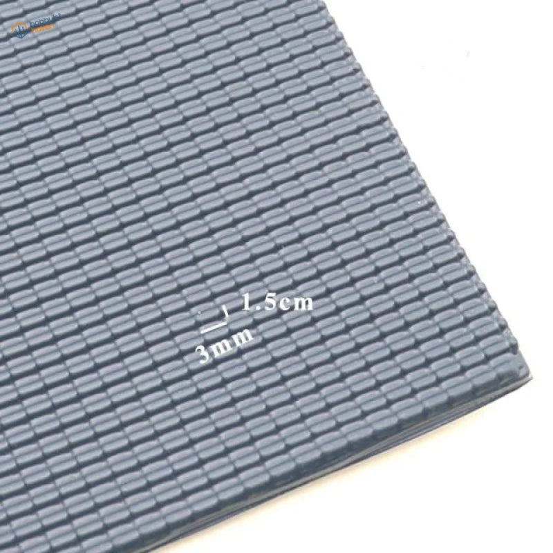 Dark gray textured PVC roof panels with interlocking grid mat pattern