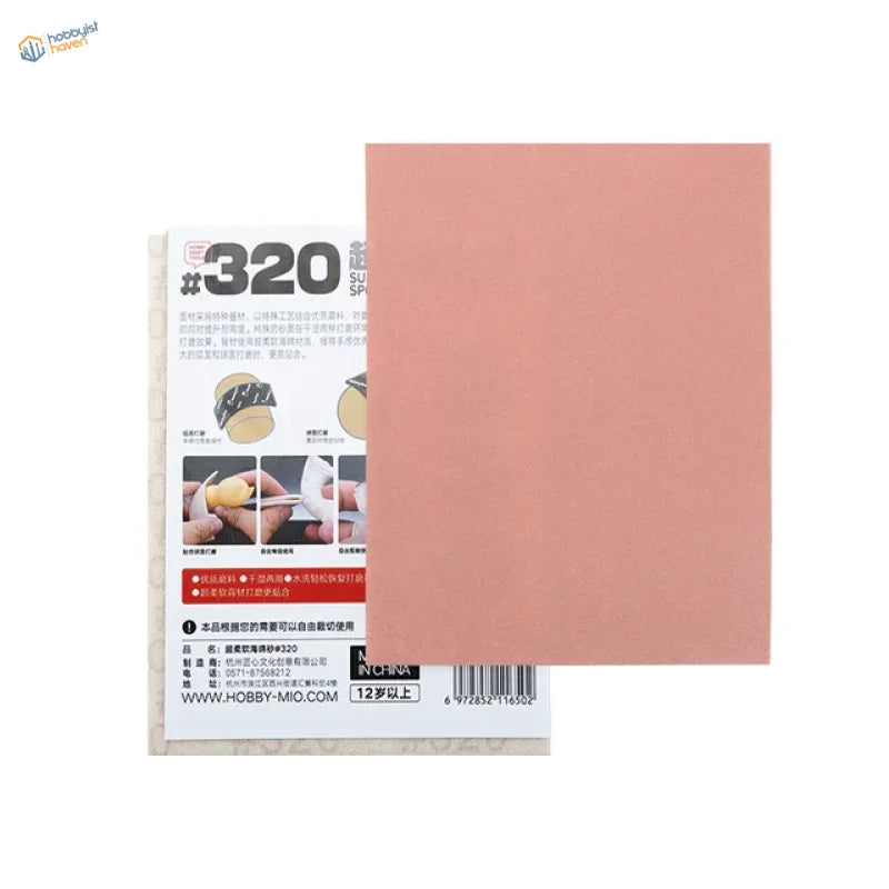 Back of 320 grit sanding sponge with peach sandpaper and white card, Hobby Mio