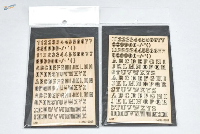 Two black packages of 3D letters numbers for dioramas scale modeling tools