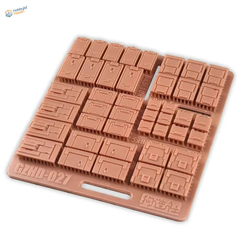 Tan silicone mold for printed armor patches with 5x8 keycap cavities