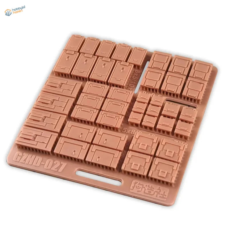 Tan silicone mold for printed armor patches with 5x8 keycap grid
