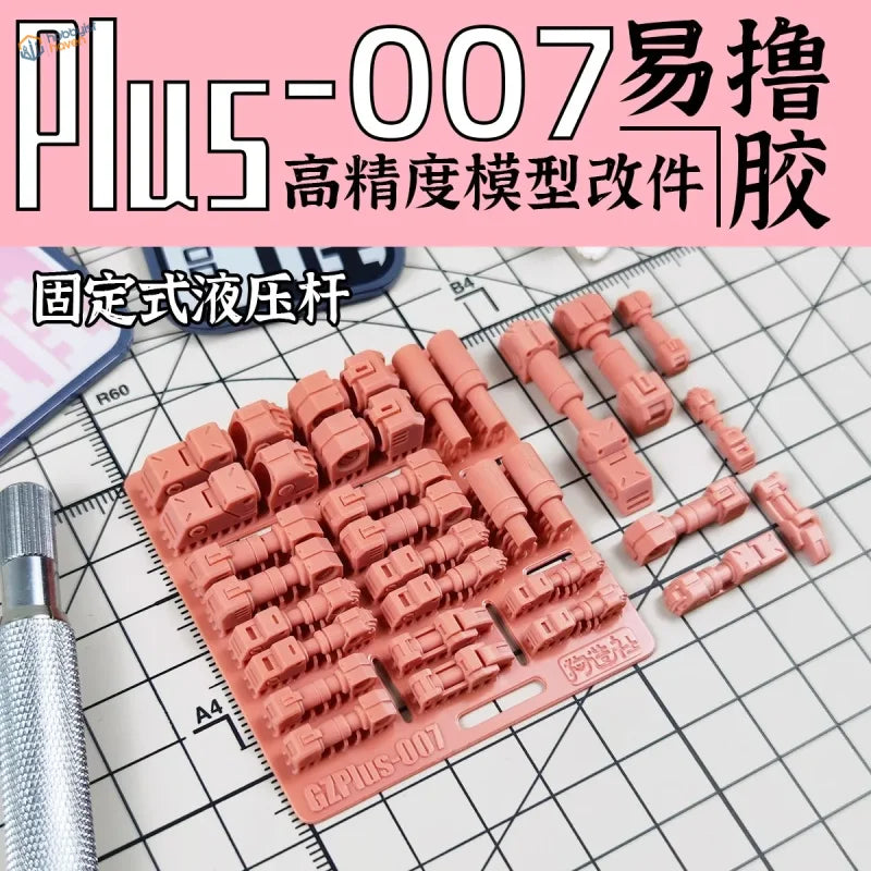 Pink plus-007 putty with molded mechanical parts in 3D printed hydraulic actuators tray