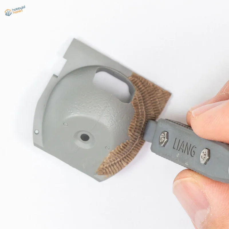 3D printed tool for Zimmerit modeling with gray textured grip and Liang branding