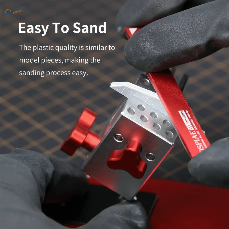 Red and silver graduated plastic board sanding tool with textured grip