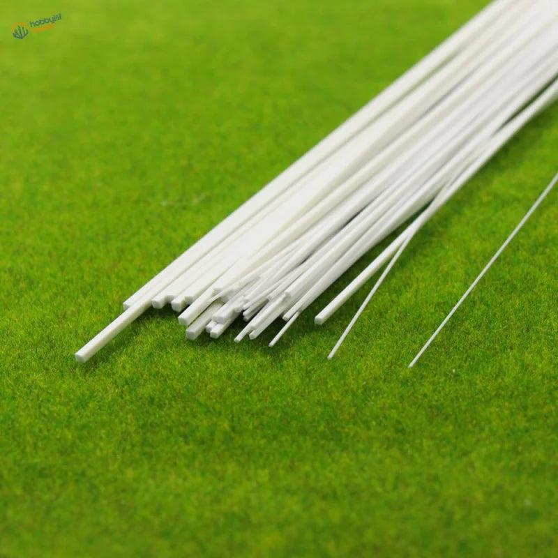 40pcs styrene square rods: white sticks diagonally on green textured surface