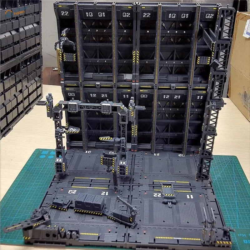 Black plastic Gundam mechanical base rack with yellow hazard stripes