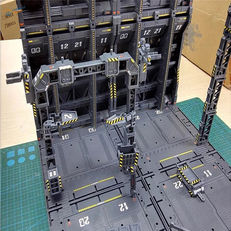 Gray Gundam mechanical base model with hazard stripes