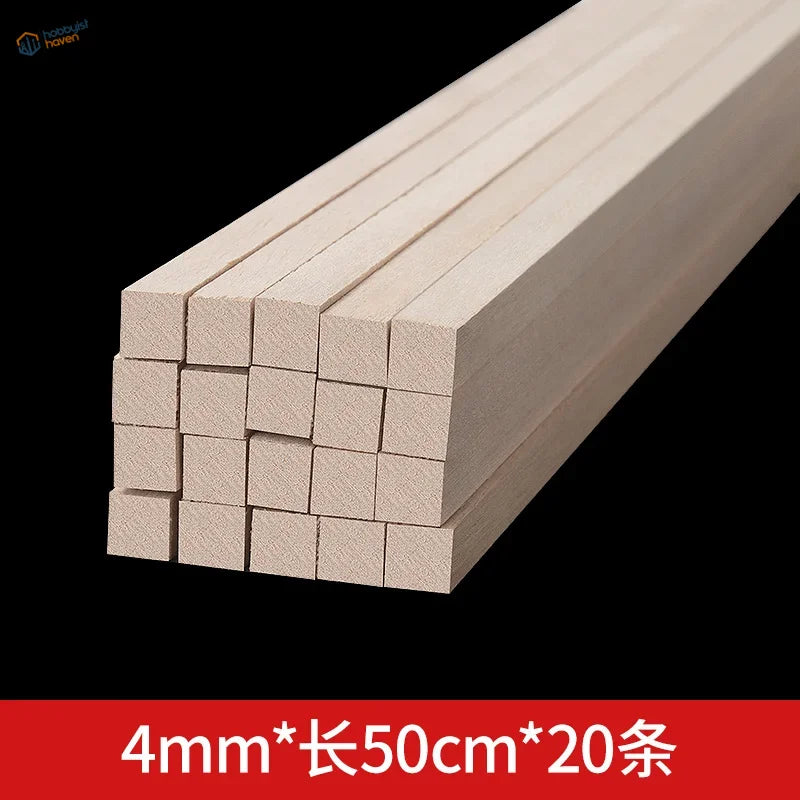 Stack of light-colored unfinished balsa wood square rods