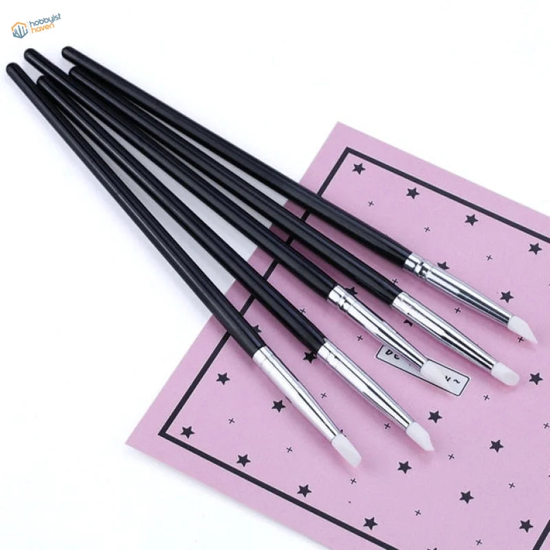 5 pcs silicone brushes with black handles on pink star surface